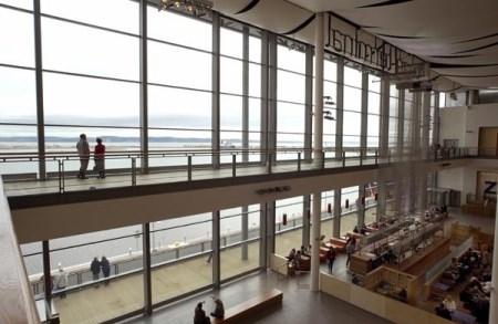 In the UK, a good example is Ocean Terminal, one of Scotland’s largest shopping centers and home to the Royal Yacht Britannia, whose complex’s frontage consists of one of the UK’s largest free-span curtain walling systems, and covering one entire side of the shopping center.  