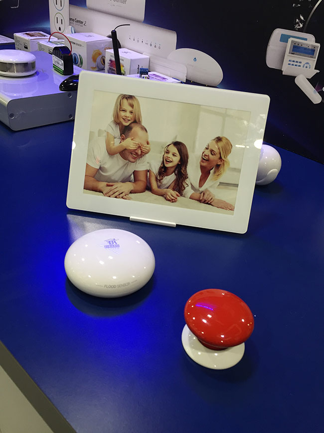 FIBARO introduced their newest gesture pad the SWIPE. The pad, shown next to two “easy buttons” for size, has the ability to store up to 6 different hand gestures that can be connected to different smart home features, such as dimming the lights or arming or disarming a security system.