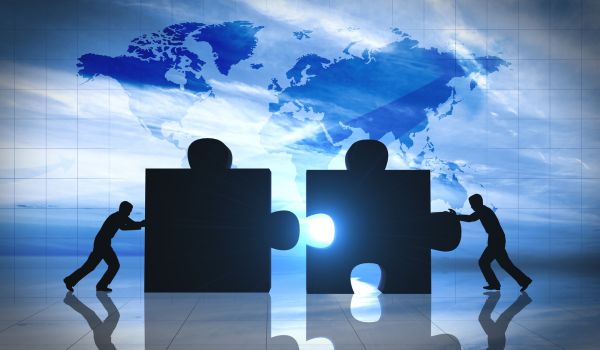 World Business teamwork puzzle pieces concept image