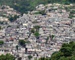 Houses crowd a hillside in Haiti