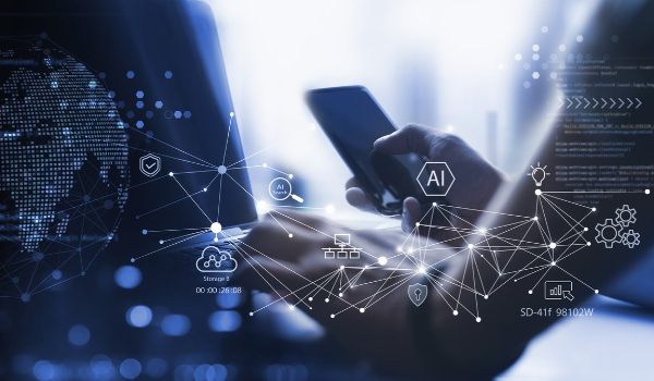 Hands holding a smartphone in front of a laptop with glowing blue digital network overlays, data nodes, and AI icons.