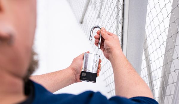 Person holding an ALBOY padlock