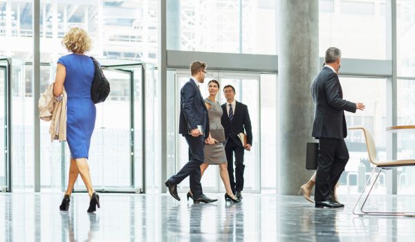 People in a building lobby.
