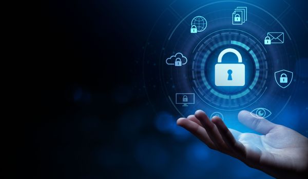 Hand holding a digital padlock surrounded by cybersecurity and data protection icons on a blue background.