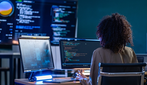 Brazilian cybersecurity expert conducting a real time threat assessment and debugging system vulnerabilities on a large scale AI monitoring display