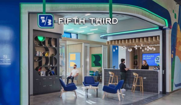 A modern, brightly lit Fifth Third Bank branch interior features a contemporary lobby design with comfortable seating areas and a service counter.
