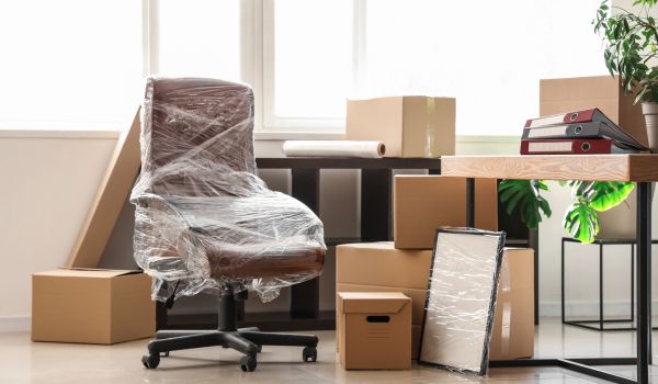 Office furniture wrapped up for move