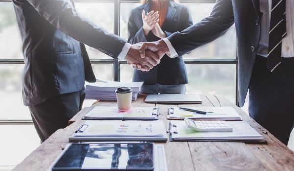 Business handshake for teamwork of business merger and acquisition