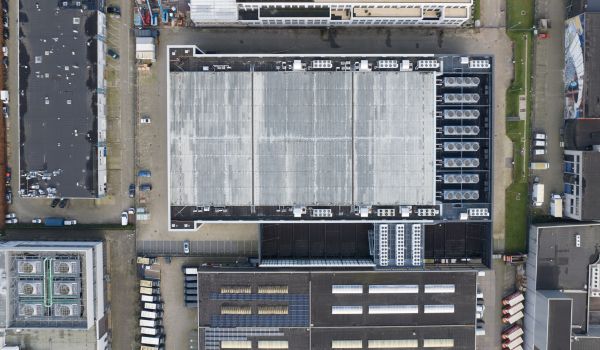 Aerial top down drone view on a data center and cooling vans build in the roof