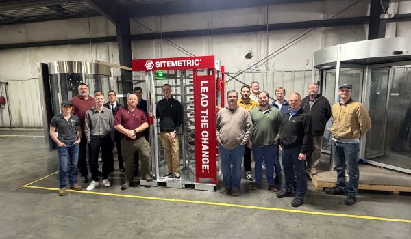 Boon Edam staff next to new Turnlock product