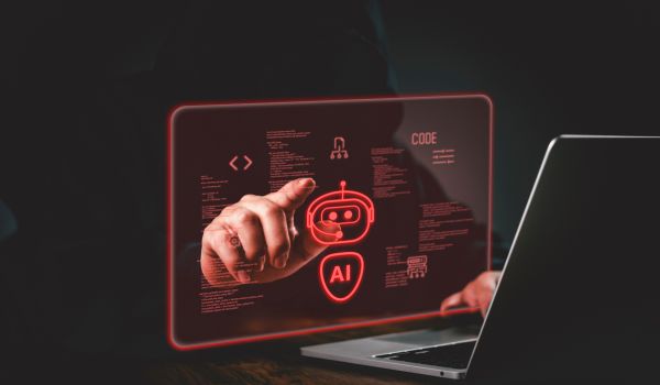 Red AI animation overlayed on person using laptop