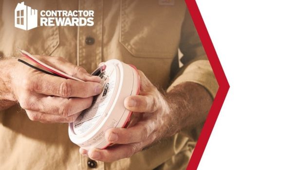 Person working on fire alarm