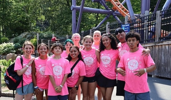 Children participating in camp and wearing matching shirts