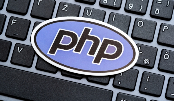 PHP programming language logo symbol on a modern desktop PC computer keyboard