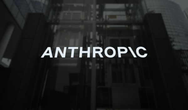Anthropic logo on the building window, artificial intelligence ANTHROPIC brand on a wall