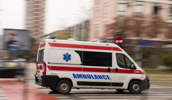 An emergency vehicle in motion.