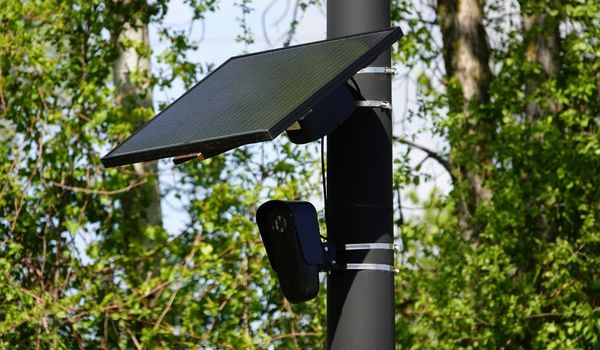Flock safety police law enforcement license plate reader set up outside to help catch vehicle speeders