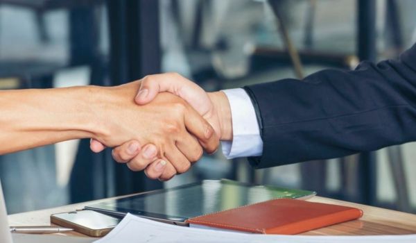 Two people shaking hands