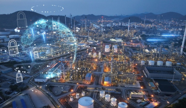 Aerial view of an industrial plant overlaid with digital network graphics and lock icons, representing cybersecurity for operational technology (OT).