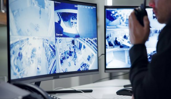 Security guard monitoring CCTV footage