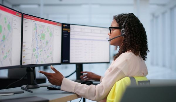Emergency personnel reviewing a map.