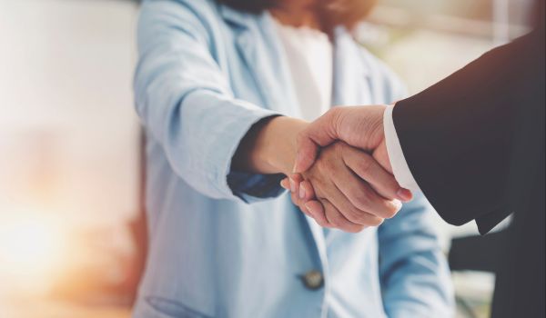 Two business people shaking hands