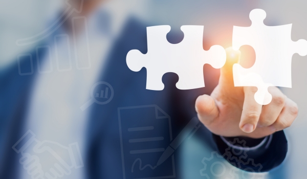 Mergers and acquisition concept with consultant touching puzzle pieces icons