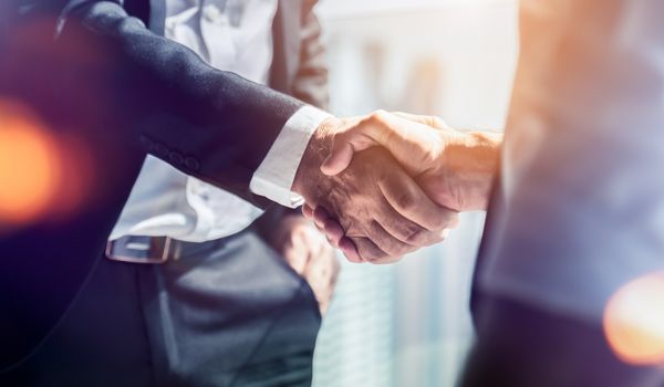 two people shaking hands