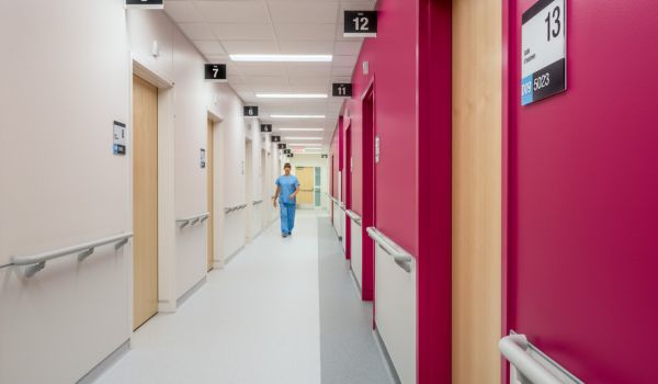 Nurse walking down hallway