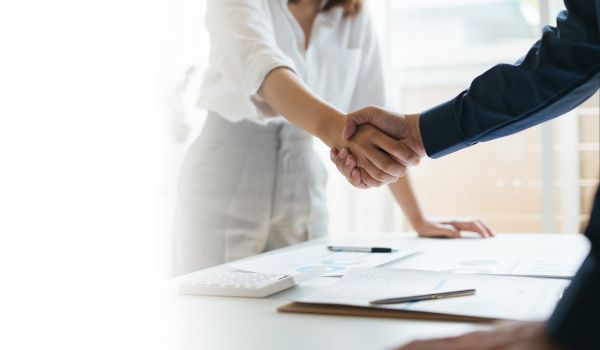 Two business people shaking hands