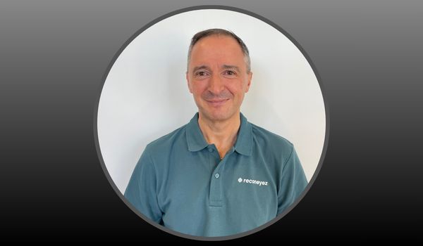 Headshot of Mark Williams on grey background