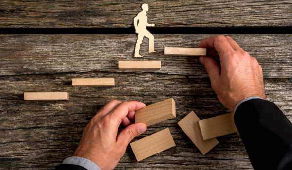 Promotion concept art with person moving building blocks