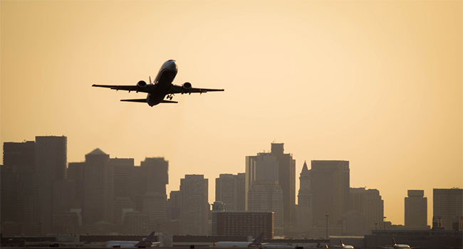 plane flying from boston airport