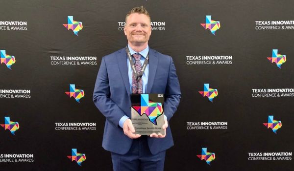 Jeremy Freeze-Skret holding award