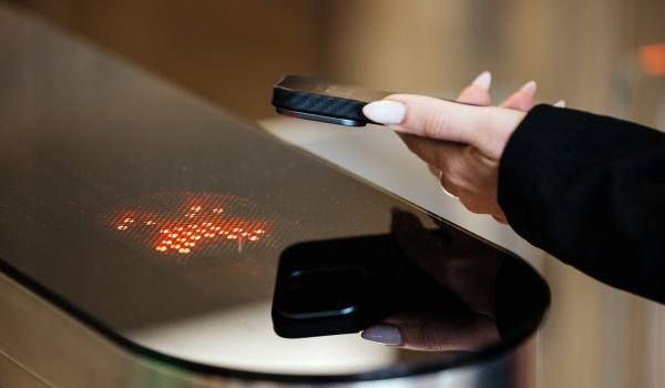 Person scanning phone to access building 